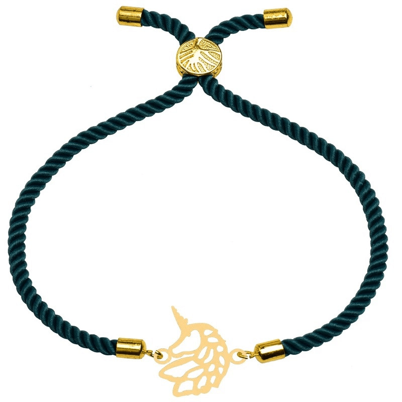 یک دستبند طلابافت سبز با یک طرح طلای تک‌شاخ طلایی روی پس‌زمینه سفید